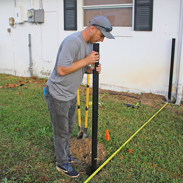 installing fence post, Sugarmill FL